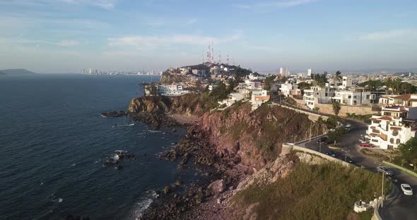 Holiday properties on rocky cliff, picturesque scenery of Mexico. Coastal landscape, aerial