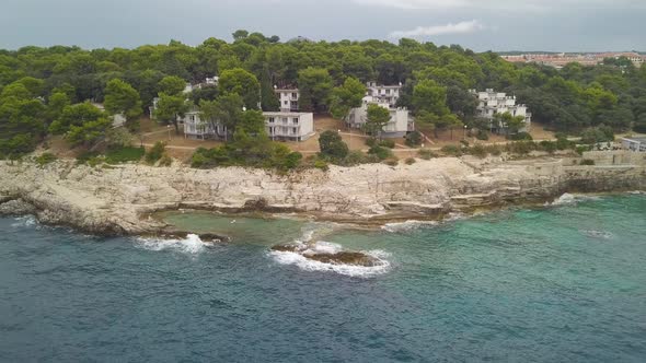 Rocky Shore With Apartments During The Storm. Aerial View From The Seaside