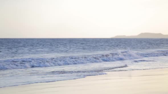 Atlantic Ocean Breaks Waves on Tenerife Beach in the Evening