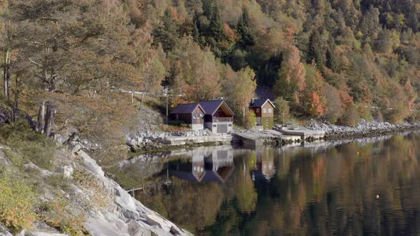 Norwegian House on the Bank of a Fjord in the Fall