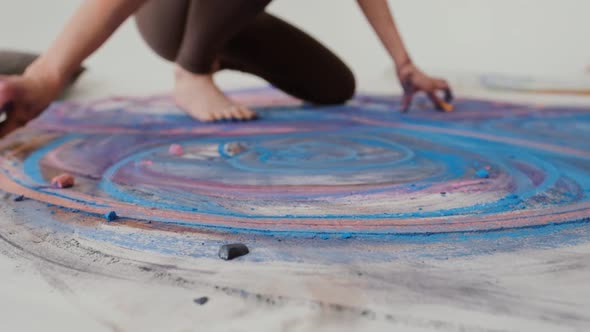 A Talented Artist Works on an Abstract Pastel Painting Using Her Hands To Draw