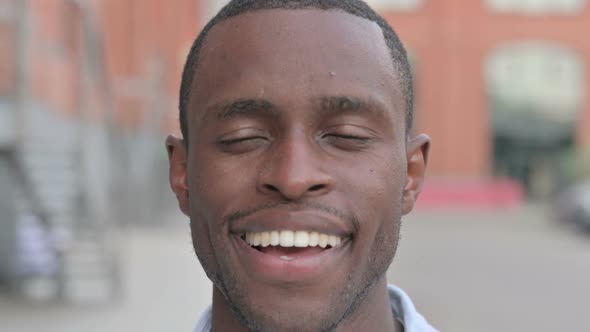 Close Up of Face of African Man Smiling at Camera