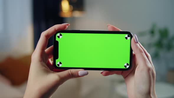 Woman Using Smartphone with Chroma Key Closeup