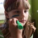 Girl dressed as Native American having face painted - VideoHive Item for Sale
