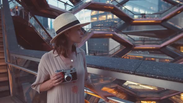 Young girl with a retro camera in the Wessel building