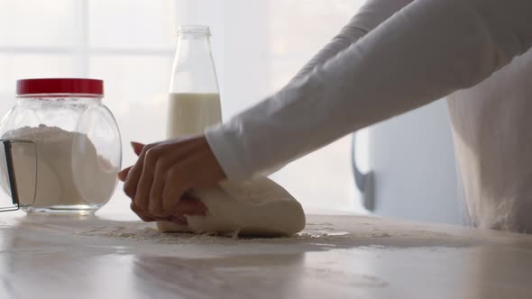 Close Up Shot of African American Female Baker Kneading Dough for Fresh Bread or Pastry Cooking