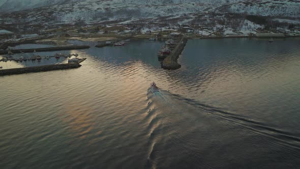 Fishing Boat Cruising Through Quiet Waters Near Tromvik Village - Aerial shot