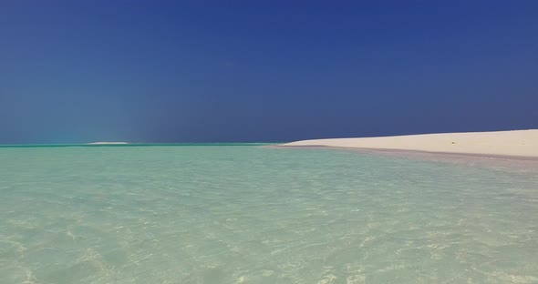 Natural fly over abstract view of a sandy white paradise beach and aqua blue ocean background in hi 