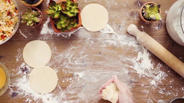 Flat lay. Step by step. Rolling dough for home made empanadas.