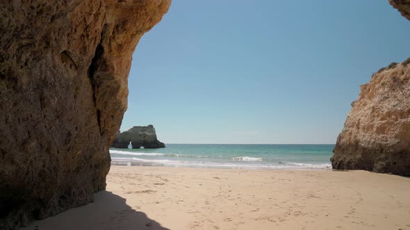 Moving Forward Stabilized Exit From the Cave to the Sea with Waves Beach for Tourists in Summer