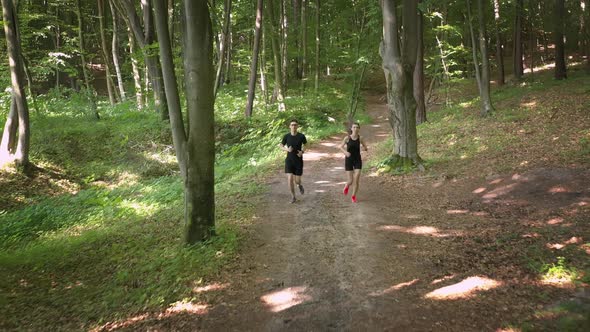Couple Running at Forest