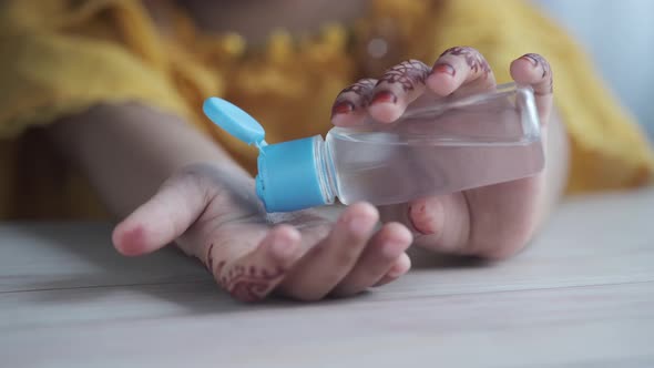 Child Hand Using Sanitizer Gel for Preventing Virus with Copy Space