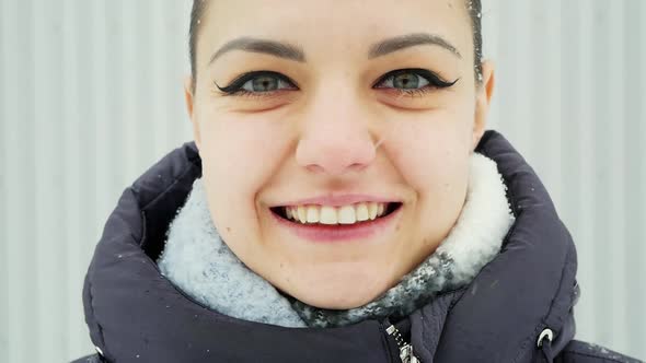 Close-up Portrait of a Happy Woman Looking at the Camera and Smile in Slow Motion