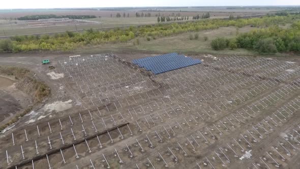 Drone Footage of the Construction Site of a Solar Power Station in the Field