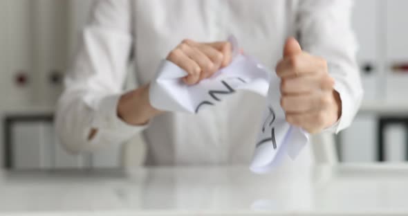 Businesswoman Tears Up Paper with Inscription Contract