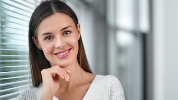 Portrait of Female Posing Near Modern Window with Jalousie