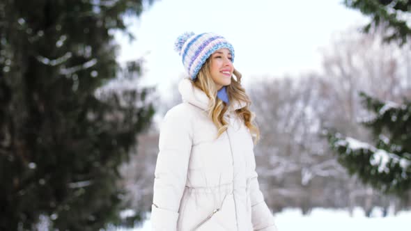 Happy Woman Walking in Winter Forest or Park 4