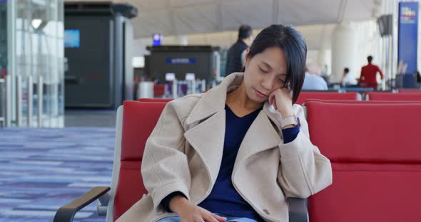 Businesswoman sleep on the wait area at the airport