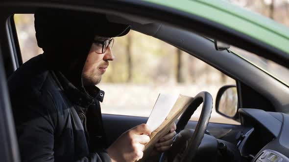 Young Private Detective Man Sitting Inside Car and Photographing with Dslr Camera