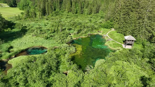 Flying over a nature park with mountains and a lake