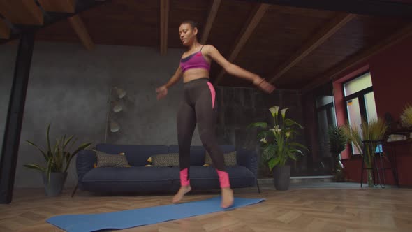 Fitness African Female Doing Jumping Jack Exercise