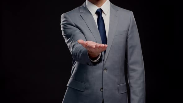 Studio portrait of successful and smart businessman in suit and tie.