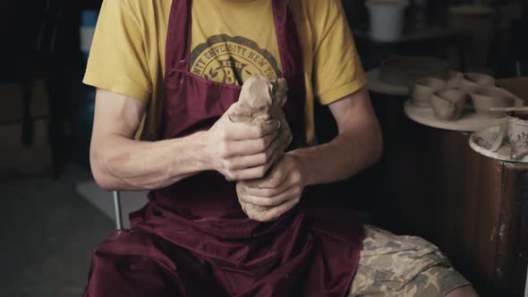 Serious Woman Working at Pottery Wheel in Studio Prepare Clay to Make Plate to Restaurant