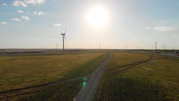 Aerial View of Wind Turbine on a Field in a Summer Day. Environment Friendly and Renewable Energy