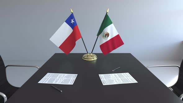 Flags of Chile and Mexico and Papers