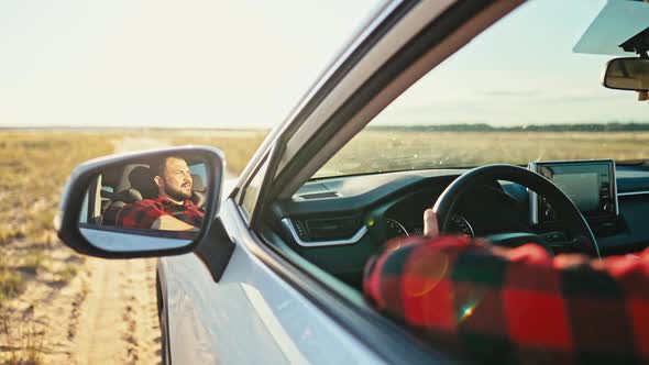 Man of a Car While Driving