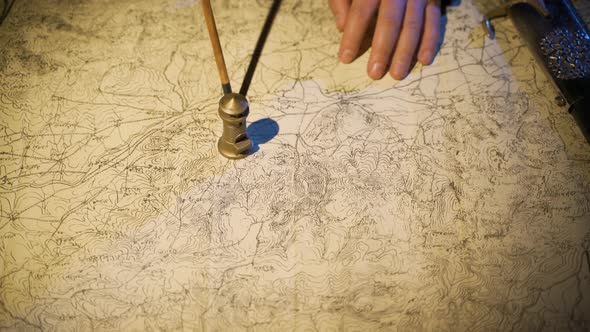 Working on a map drawn in the Middle Ages. alt