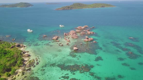Aerial View at Beautiful Island Paradise with Crystal Clear Tuquoise Blue Water.