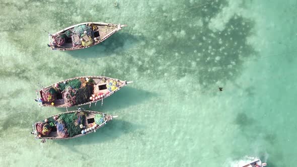 Vertical Video Boats in the Ocean Near the Coast of Zanzibar Tanzania Aerial View