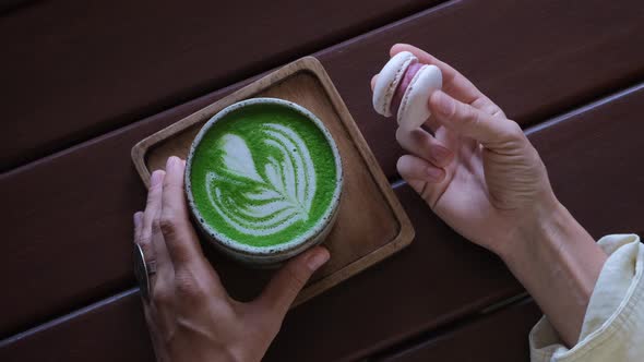 Top View of Matcha Mug with Green Foam in the Shape of a Heart