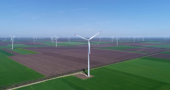 4K aerial drone view of a wind turbine. Windmill for electric power production.