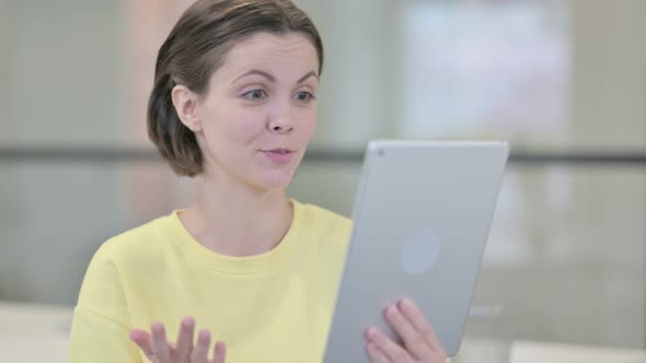 Video Call on Tablet By Young Woman