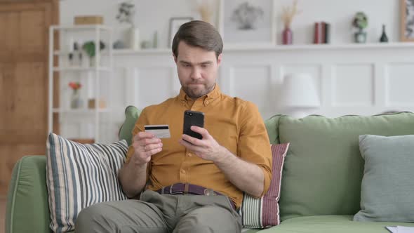 Young Man Unsuccessful Online Payment on Smartphone