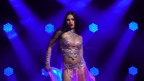 Beautiful Oriental Belly Dancer Is Passionate Wriggles in Dance, Demonstrating the Grace and