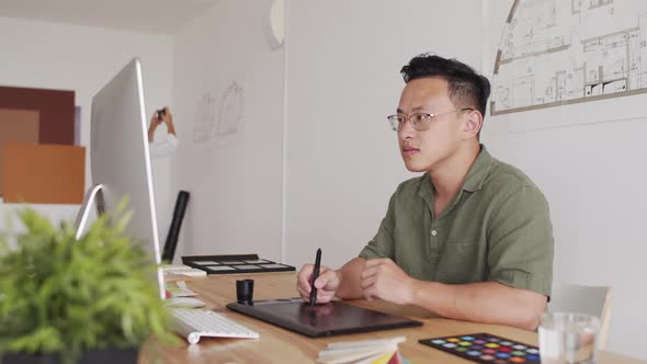 Portrait of Asian Male Architect with Graphic Tablet