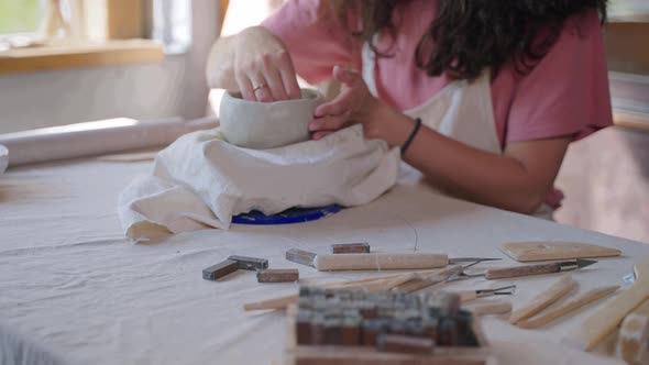 Talented and Skilled Woman is Making Ceramic Bowl in Pottery Workshop