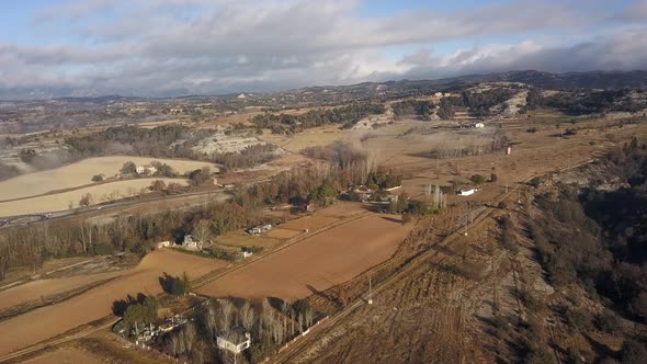 Aerial view of rural area with flat dry land crossed by country roads