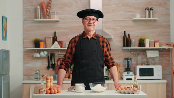 Portrait of Chef Wearing Bonete Looking at Camera