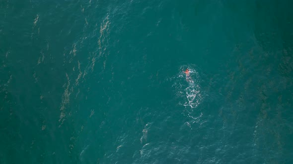 A Man Swims in the Sea Aerial View Turkey Alanya