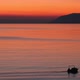 Small Boat Silhouette On Calm Sea At Sunset - VideoHive Item for Sale