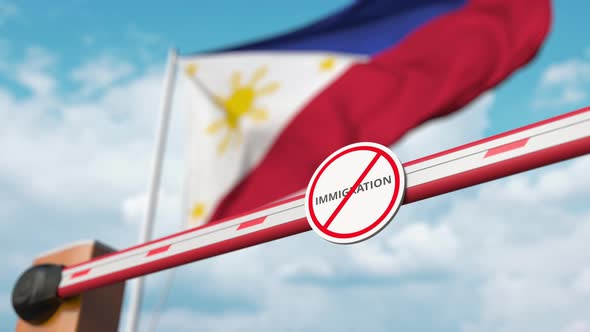 Barrier Gate with No Immigration Sign Opened at Flag of the Philippines