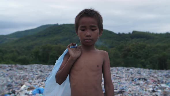 Poor Asian Boy With Garbage Dump