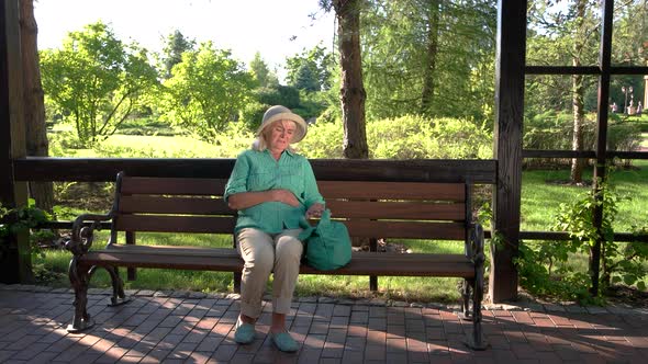 Elderly Woman Holding Her Stomach