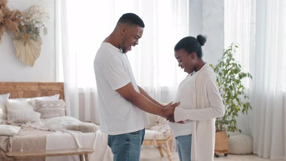 African Couple Future Parents Stand at Home Afro Man Caring Husband Happy Father Holding Hands