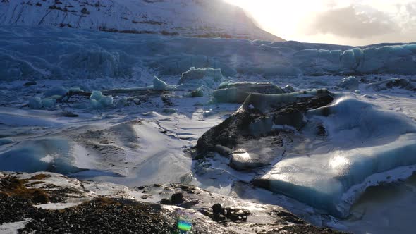 Iceland Giant Blue Glacier Ice Chunks With The Sun Peaking