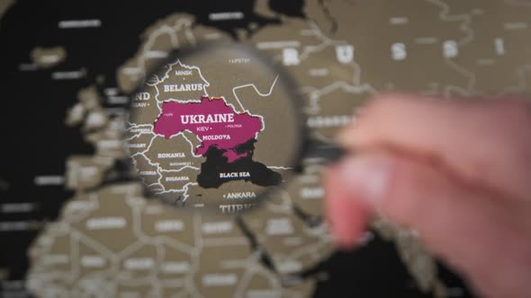 Ukraine on the World Map Under a Magnifier Loupe Worldwide Attention to War